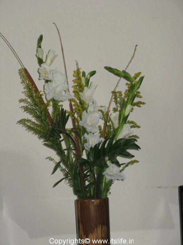 Tall container flower arrangement